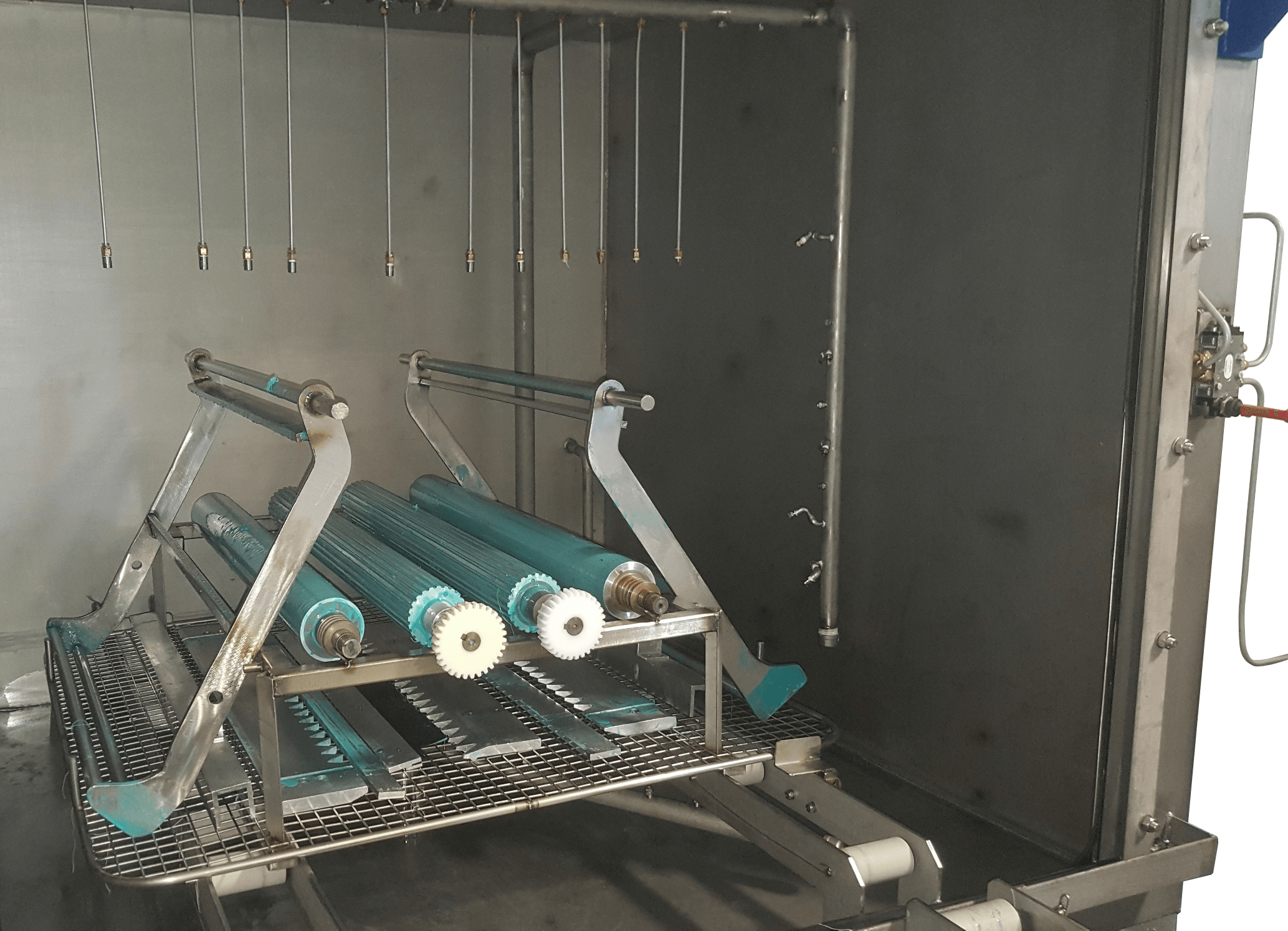 Machine parts being decontaminated in ATEX washer